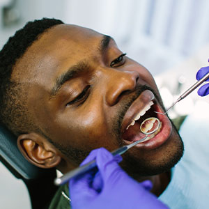Warren C. Baine, D.M.D. | Bone Grafting and Guided Tissue Regeneration, Scaling   Root Planing and Initial Oral Examination